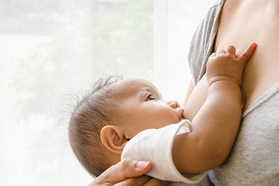 Mother breastfeeding infant